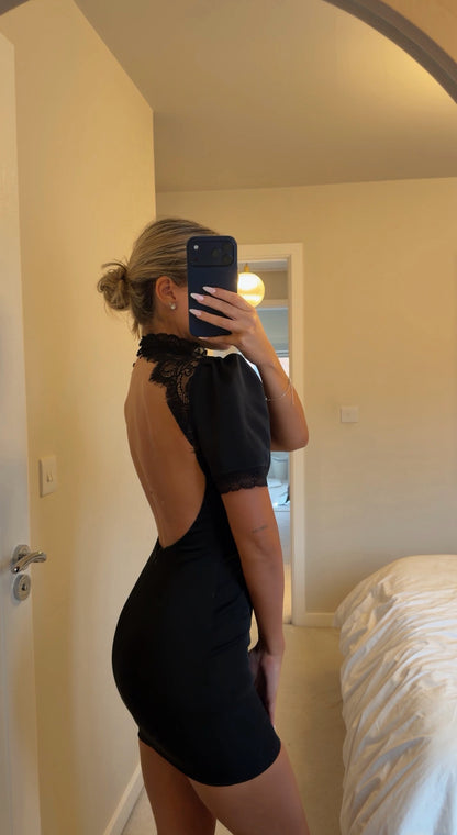 Black satin dress with lace detailing on back
