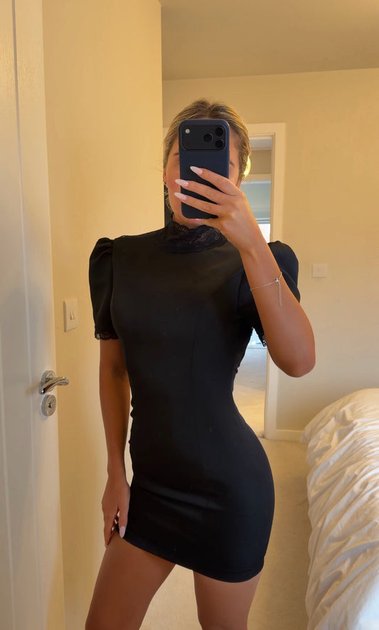 Black satin dress with lace detailing on back